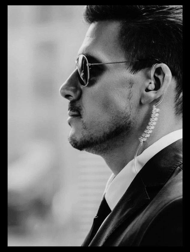 Security officer with earpiece on detail